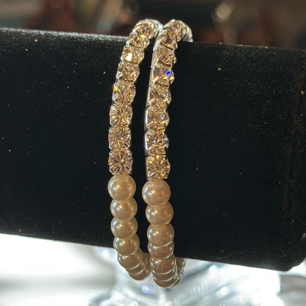 Two. Bracelets with faux pearls and faux diamonds on stretchy bracelets.​